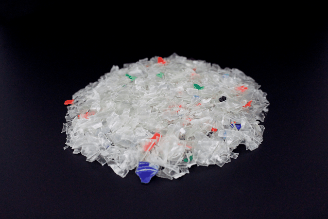 Probendarstellung: PET-Flakes mit minimal PP, PVC, PE, weiß mit Fehlfarbe